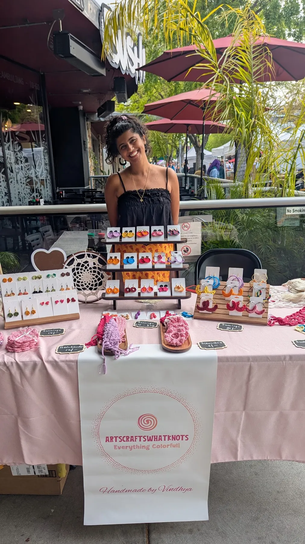 Vindhya at her market stall of handmade crochet