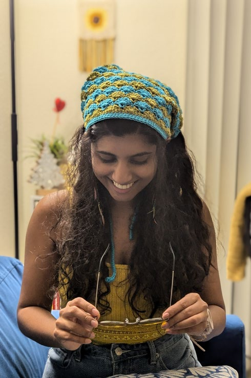 The shell scarf worn as a head wrap
